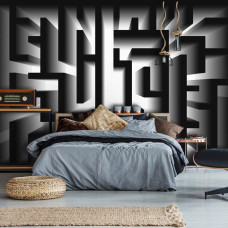 Een fotobehang met een zwart-wit doolhof in een abstract ontwerp, passend voor de slaapkamer.