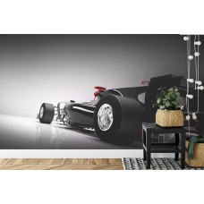 Een fotobehang van een dynamische Formule 1-auto die snelheid uitstraalt in een kinderkamer.