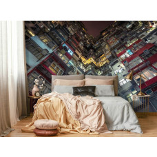 Een fotobehang van een flatgebouw in een stad voor de slaapkamer.