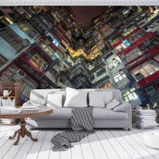 Een fotobehang van een flatgebouw in een stad voor de woonkamer.