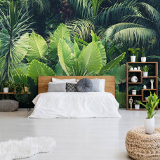 Een fotobehang met groene bladeren en een natuurlijke jungle-uitstraling, perfect voor een slaapkamer.