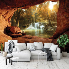 Een fotobehang van een waterval zichtbaar vanuit een grot in de huiskamer.