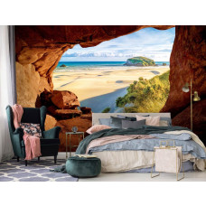 Een fotobehang met uitzicht op het strand en duinen vanuit een grot voor de slaapkamer.