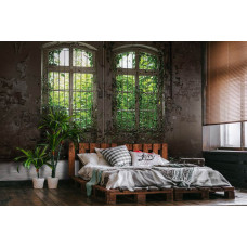 Een fotobehang met een industrieel gebouw en planten, perfect voor een slaapkamer.