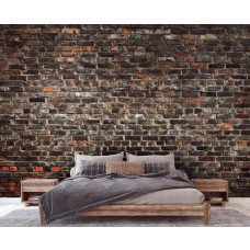 Een fotobehang van een industriėle stenen muur met urban stijl in een slaapkamer.