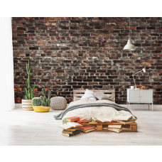 Een fotobehang van een industriėle stenen muur met urban stijl in een tienerkamer.