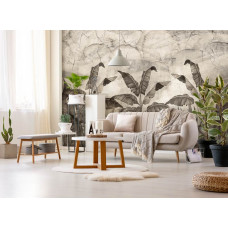 Een fotobehang met jungleplanten en bladeren tegen een betonnen muur, ideaal voor een woonkamer.