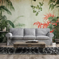 Een fotobehang met jungle planten op beton in een botanisch design, bedrukt op vliesbehang, ideaal voor een woonkamer.