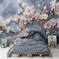 Een fotobehang van kersenbloesem bloemen op takken in sakura stijl op vliesbehang in de slaapkamer.