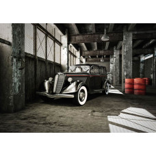 Fotobehang van een klassieke auto in een oude garage, oldtimer thema.