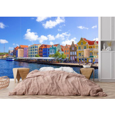 Fotobehang van Willemstad met kleurrijke huizen in een sfeervolle slaapkamer.