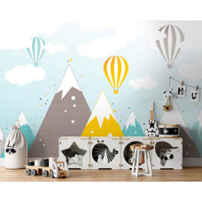 Een fotobehang met luchtballonnen boven bergtoppen voor kinderen in de speelkamer.