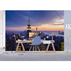 Fotobehang met een zonsondergang boven de skyline van New York in een kantoor.