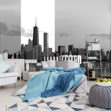Een fotobehang van een stedelijke skyline van New York en Chicago, geplaatst in een slaapkamer.