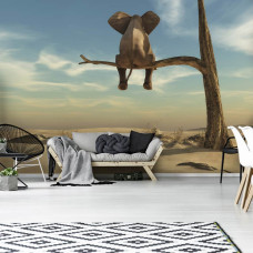 Een fotobehang met een olifant bij een eenzame boom in een woestijnlandschap in een sfeervolle woonkamer.