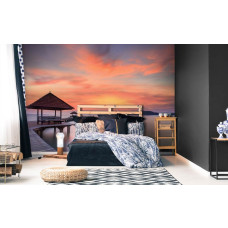 Een fotobehang van een pier langs de zee voor de slaapkamer.