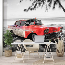 Fotobehang van een klassieke auto in het hart van Cuba, met kleurrijke huizen, ideaal voor kantoor.