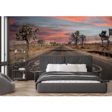 Fotobehang met eindeloze woestijnweg en warme zonsondergang in de slaapkamer.