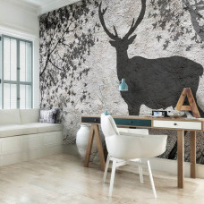 Een fotobehang met de schaduw van een hert op een betonnen muur voor het kantoor.