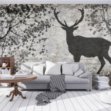 Een fotobehang met de schaduw van een hert op een betonnen muur voor de woonkamer.