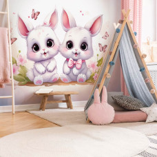 Een fotobehang van schattige konijntjes en vlinders in een meisjeskamer.