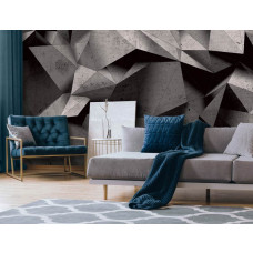 Een fotobehang met geometrische vormen in zwart-grijze stenen, perfect voor een woonkamer.