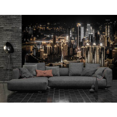 Een fotobehang van een stad in de nacht voor de huiskamer.