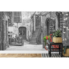 Een fotobehang met een kleurrijke straat in Pienza, Toscane, Italiė, weergegeven in een levendige setting.