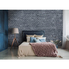 Een fotobehang met een antraciet stenen muur in een stijlvolle slaapkamer.