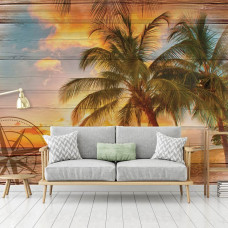 Een fotobehang met een tropische zonsondergang en palmboom in een rustige slaapkamer.