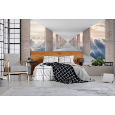 Een fotobehang met een tunnel en uitzicht op de wolken in 3D-effect voor de slaapkamer.