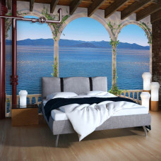 Een fotobehang van een Grieks balkon met uitzicht op zee en pilaren in de slaapkamer.