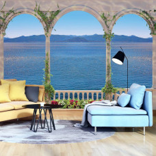 Een fotobehang van een Grieks balkon met uitzicht op zee in de woonkamer.