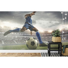 Een fotobehang met een voetballer in actie in een stadion in een kinderkamer.