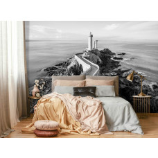 Een fotobehang van een vuurtoren aan de zee met een landschap voor de slaapkamer.