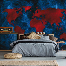 Een fotobehang met een wereldkaart in rood en blauw als abstract schilderij voor de slaapkamer.