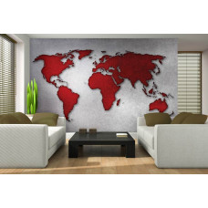 Een fotobehang met een abstracte wereldkaart op een betonnen muur in rood en grijs.