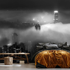 Een fotobehang van wolkenkrabbers in de nacht in New York, met wolken die een stedelijke sfeer geven aan de slaapkamer.