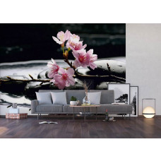 Een fotobehang van zenstenen en kersenbloesem in een woonkamer met vliesbehang.