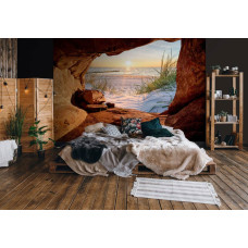 Een fotobehang van een zonsondergang boven de zee in naadloos behang voor een slaapkamer.