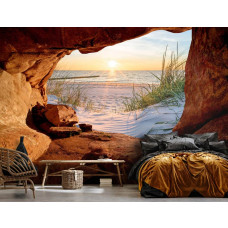 Een fotobehang van een zonsondergang boven de zee, gezien vanuit een grot in 3D-perspectief, in een sfeervolle slaapkamer.