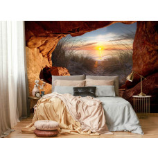 Een fotobehang van een zonsondergang vanuit een grot in naadloos behang voor een slaapkamer.