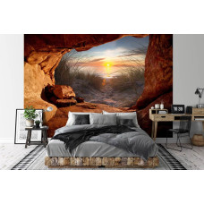 Een fotobehang van een zonsondergang vanuit een grot met een serene uitstraling in een slaapkamer.
