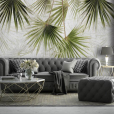 Een fotobehang met exotische jungle planten op beton, bedrukt op vliesbehang, ideaal voor een woonkamer.