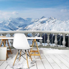 Een fotobehang van een terras met uitzicht op besneeuwde bergen, dat een serene en indrukwekkende sfeer geeft. Perfect voor een kantoor om een kalmerende en inspirerende uitstraling te creėren.