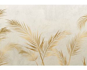 Fotobehang van gouden bladeren op beton, met een moderne en artistieke sfeer.