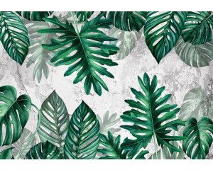 Fotobehang met jungle bladeren op een betonnen muur, botanisch ontwerp met een industriële achtergrond voor een moderne uitstraling.