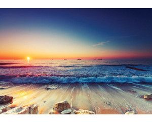 Strandbehang met zonsondergang aan zee, fotobehang met warme tinten.